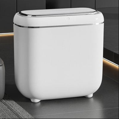 Gros plan poubelles de cuisine blanche dans décor ardoise