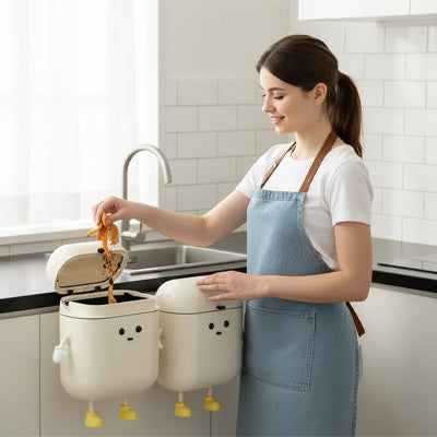 Personne jetant déchets dans poubelle murale accrochées devant évier