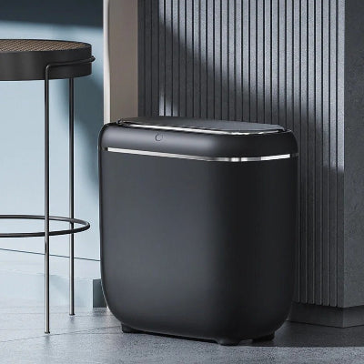 Poubelles de cuisine près ilot et tabouret moderne