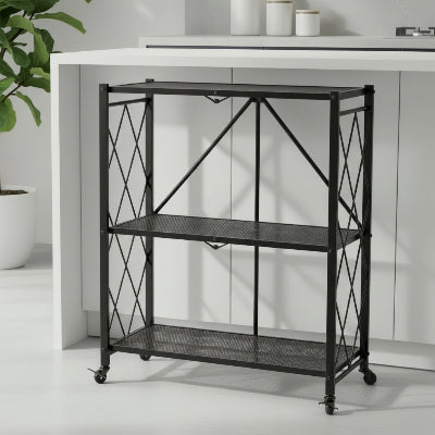Étagère micro onde pliable noire à trois niveaux devant îlot
